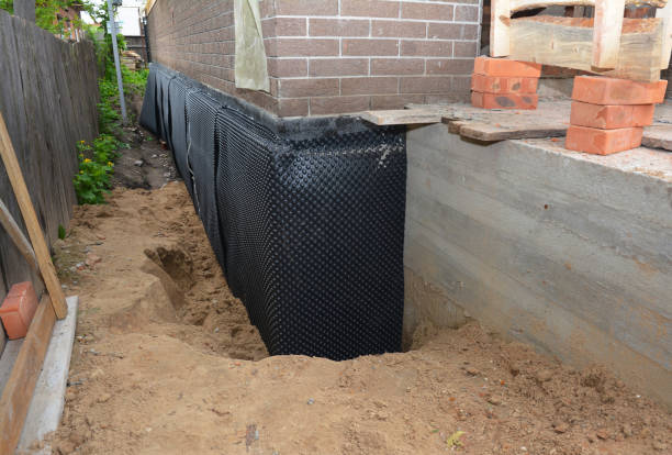 SJ Waterproofing Pros technician performing targeted Waterproofing assessment in Hughesville, MD